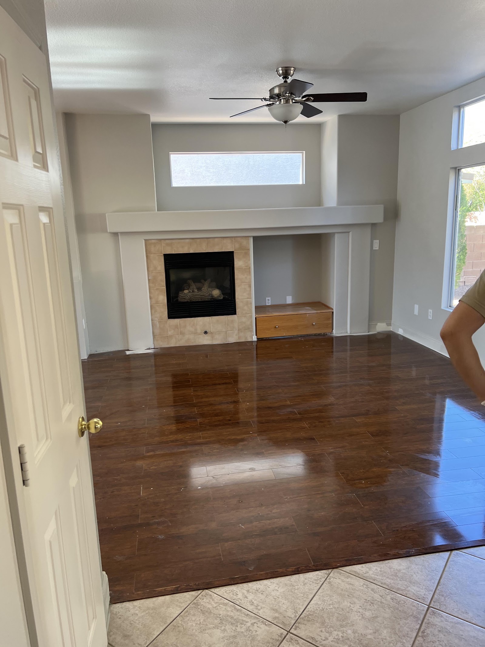 Clean empty living room with hardwood floors and fireplace